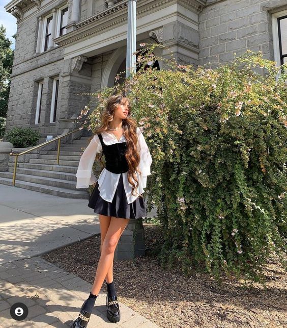 Black Velvet Corset over White Blouse with Black Pleated Skirt 